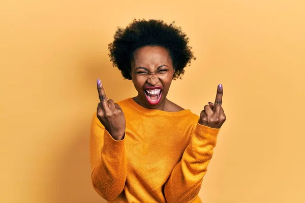 Young African American Woman Wearing Casual Clothes Showing Middle Finger — стоковое фото