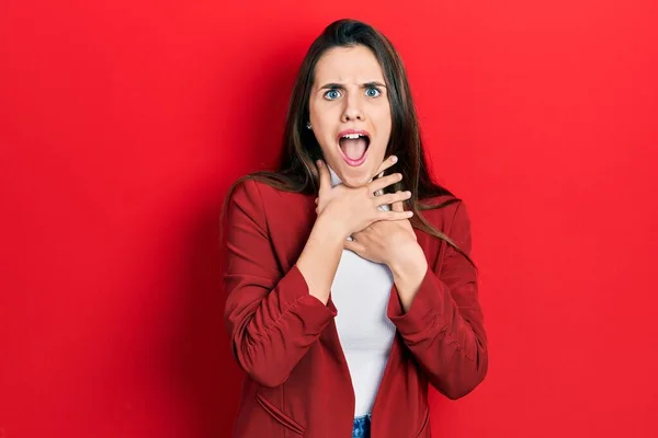 Young Brunette Teenager Wearing Business Jacket Shouting Suffocate Because Painful — Stock Photo, Image