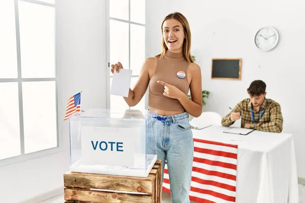 Young Blonde Girl Voting Putting Envelop Ballot Box Smiling Happy — Fotografia de Stock
