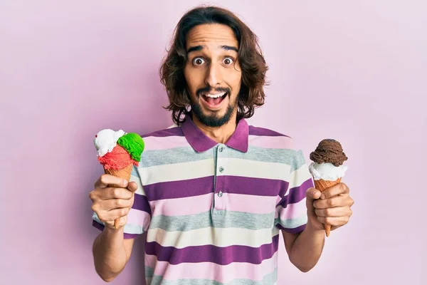 Young Hispanic Man Holding Ice Cream Celebrating Crazy Amazed Success — Stock Photo, Image