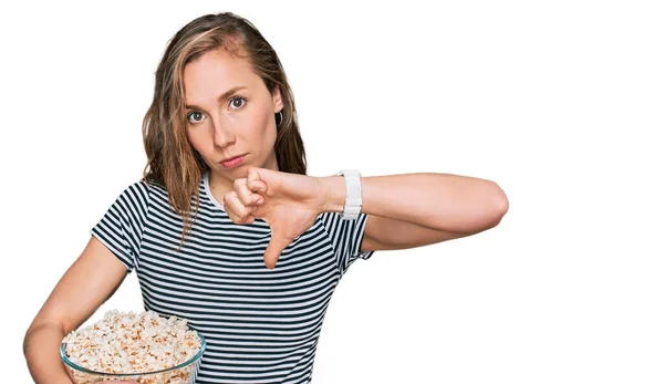 Young Blonde Woman Eating Popcorn Angry Face Negative Sign Showing — Stock Photo, Image