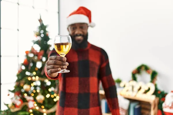 Young African American Man Toasting Champagne Standing Christmas Tree Home — Stock Photo, Image