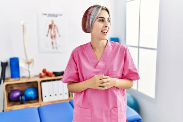 Young Nurse Woman Working Pain Recovery Clinic Looking Away Side — Stock Photo, Image