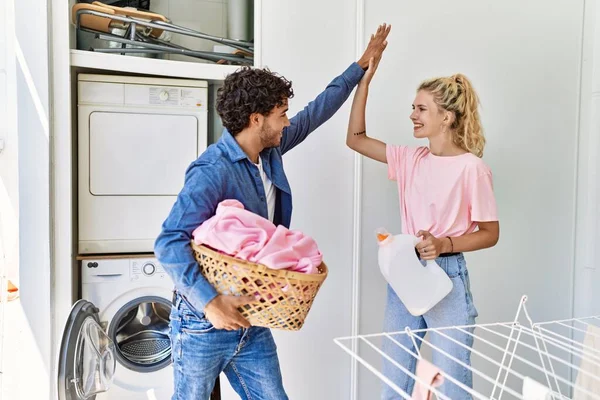 Young Couple Smiling Happy Holding Laundry Basket Detergent Bottle High — Stock Photo, Image