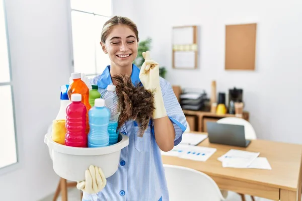 Young Blonde Woman Wearing Cleaner Uniform Holding Cleaning Products Gesturing — Stock Photo, Image