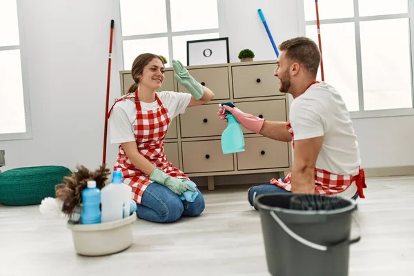 Young Caucasian Couple Cleaning Playing Sprayer Home — Stock Photo, Image