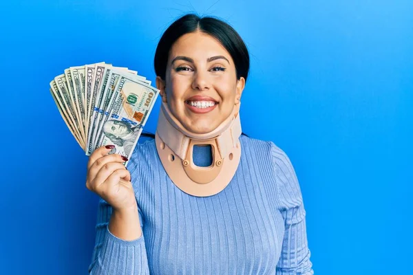 Beautiful Brunette Woman Wearing Cervical Collar Holding Insurance Money Looking — Stock Photo, Image