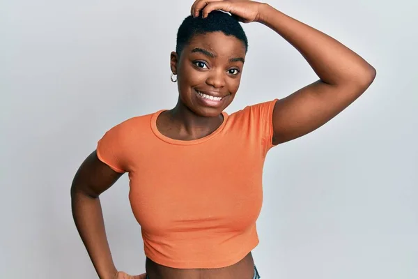 Young African American Woman Wearing Casual Orange Shirt Confuse Wonder — Stock Photo, Image