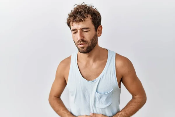 Homem Bonito Jovem Sobre Fundo Isolado Com Mão Estômago Porque — Fotografia de Stock