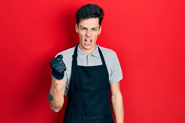 Young Hispanic Man Wearing Apron Angry Mad Raising Fist Frustrated — Stock Photo, Image