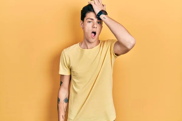 Young Hispanic Man Wearing Casual Yellow Shirt Surprised Hand Head — Stock Photo, Image