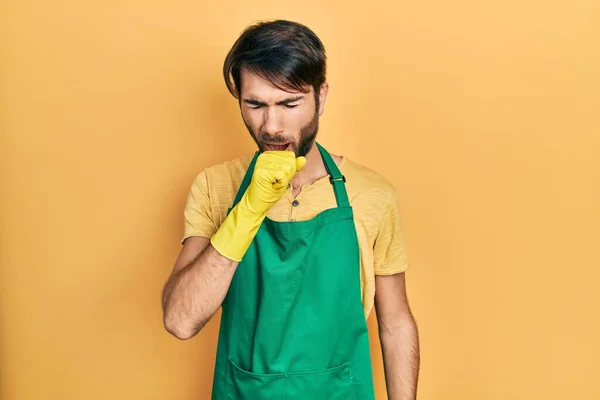 Young Hispanic Man Wearing Cleaner Apron Gloves Feeling Unwell Coughing — Stock Photo, Image
