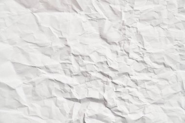 Kırışıklıkları olan beyaz buruşuk kağıt dokusu. Hasarlı ve yırtık çarşaf
