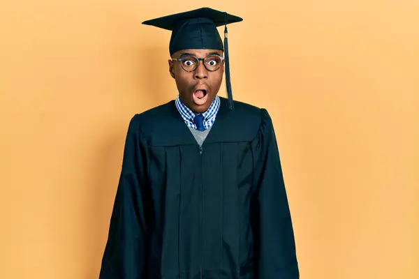 Young African American Man Wearing Graduation Cap Ceremony Robe Afraid — Stock Photo, Image