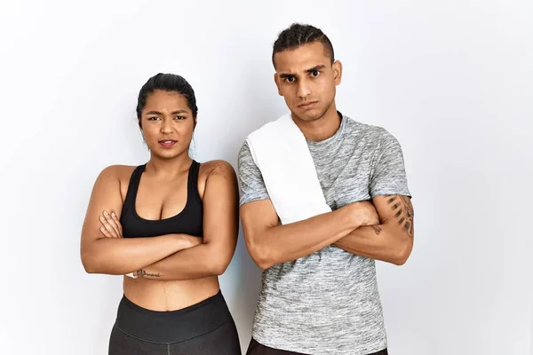 Young Latin Couple Wearing Sportswear Standing Isolated Background Skeptic Nervous — Foto de Stock