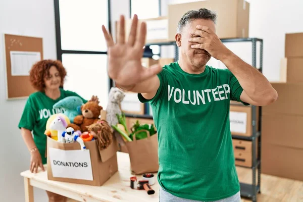 Middle Age Man Wearing Volunteer Shirt Donations Stand Covering Eyes — Stock Photo, Image