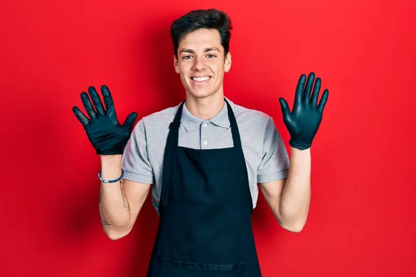 Young Hispanic Man Wearing Apron Showing Pointing Fingers Number Ten — Stock Photo, Image