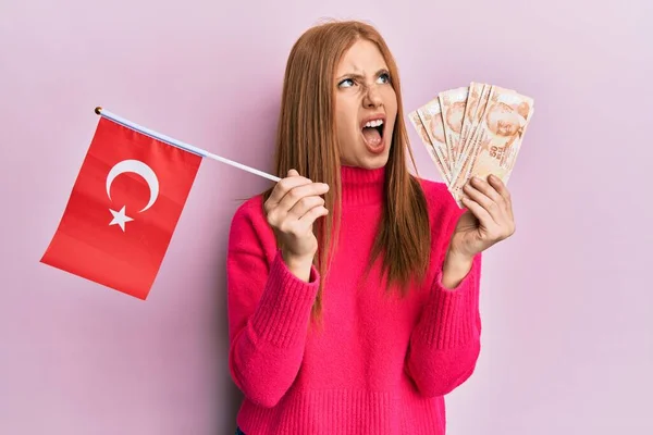 Young Irish Woman Holding Turkey Flag Liras Banknotes Angry Mad — Stock Photo, Image