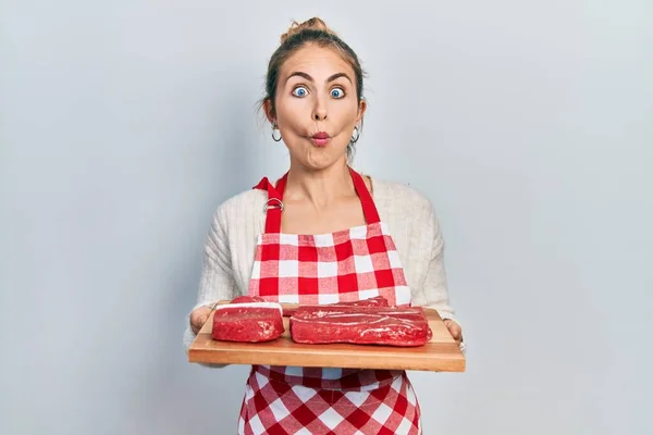 Young Caucasian Woman Holding Board Raw Meat Making Fish Face — Stock Photo, Image