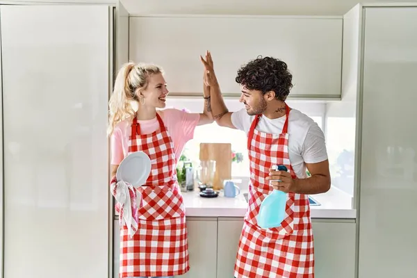 Young Couple Smiling Happy Washing Dishes High Five Kitchen — ストック写真