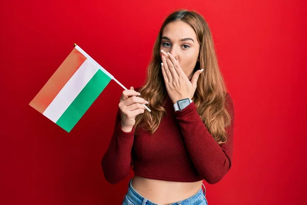 Young Blonde Woman Holding Hungary Flag Covering Mouth Hand Shocked — 图库照片