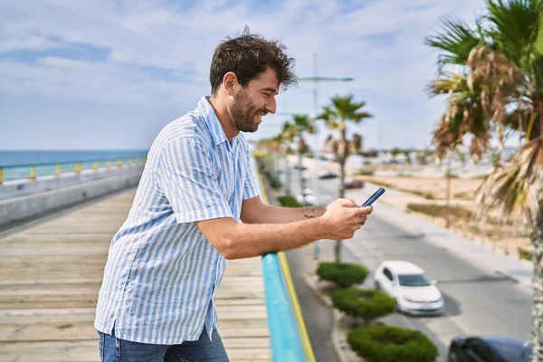 Young Hispanic Man Smiling Happy Using Smartphone Promenade — Stock Photo, Image