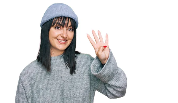 Young Hispanic Woman Wearing Cute Wool Cap Showing Pointing Fingers — Stock Photo, Image