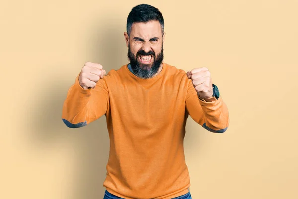 Hispanic Man Beard Wearing Casual Winter Sweater Angry Mad Raising — Stockfoto