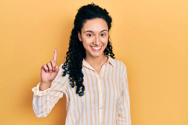 Young Hispanic Woman Curly Hair Wearing Casual Striped Shirt Smiling — Stockfoto