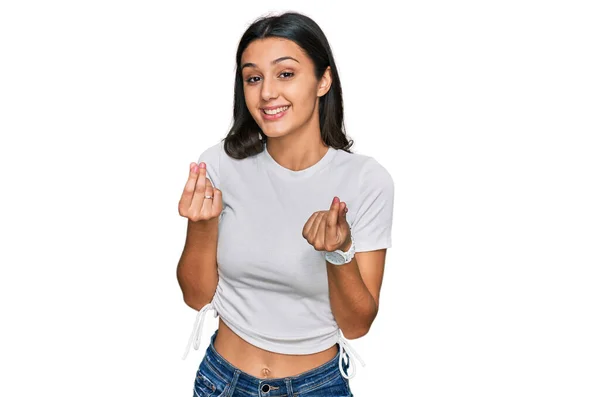 Junges Hispanisches Mädchen Lässigem Weißem Shirt Macht Geldgeste Mit Den — Stockfoto