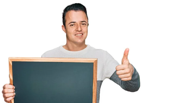 Handsome Young Man Holding Blackboard Smiling Happy Positive Thumb Doing — Photo