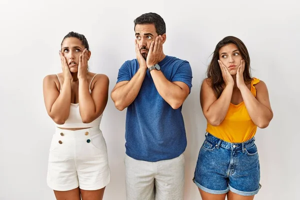 Grupp Unga Latinamerikaner Står Över Isolerade Bakgrund Trötta Händer Täcker — Stockfoto