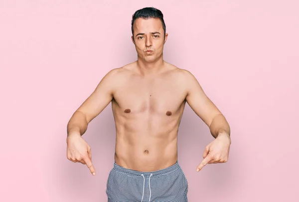 Handsome Young Man Wearing Swimwear Shirtless Pointing Looking Sad Upset — Stockfoto