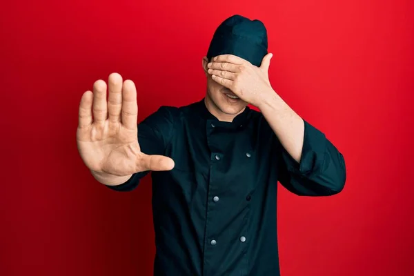 Handsome Young Man Wearing Professional Cook Uniform Hat Covering Eyes — Φωτογραφία Αρχείου