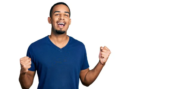 Young African American Man Wearing Casual Shirt Celebrating Surprised Amazed — Stockfoto