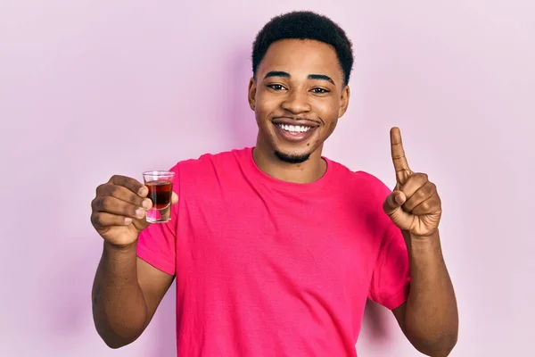 Young African American Man Drinking Whiskey Shot Smiling Idea Question — Foto de Stock