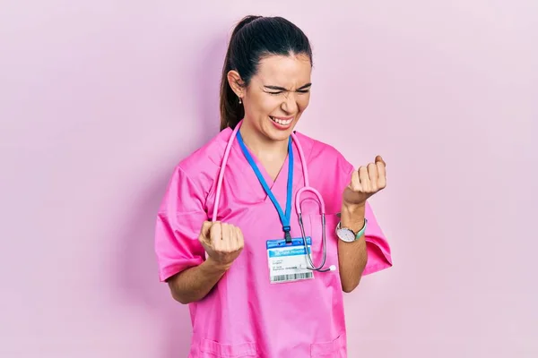 Young Brunette Woman Wearing Doctor Uniform Stethoscope Celebrating Surprised Amazed — Fotografia de Stock