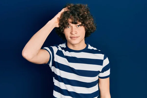 Handsome Young Man Wearing Casual Striped Shirt Confuse Wonder Question —  Fotos de Stock
