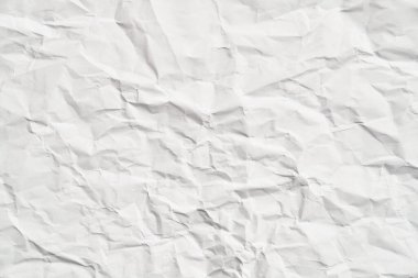 Kırışıklıkları olan beyaz buruşuk kağıt dokusu. Hasarlı ve yırtık çarşaf