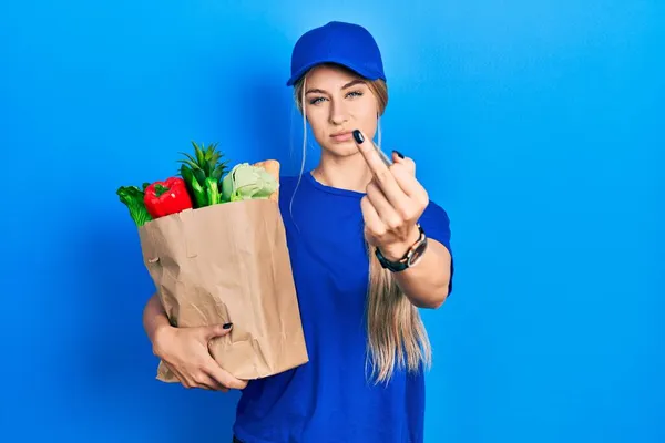 Young Caucasian Woman Wearing Courier Uniform Groceries Supermarket Showing Middle — 图库照片