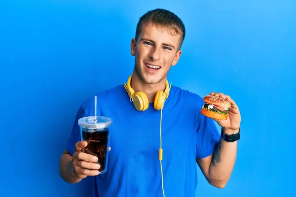 Young Caucasian Man Eating Tasty Classic Burger Soda Smiling Laughing — Stock Photo, Image