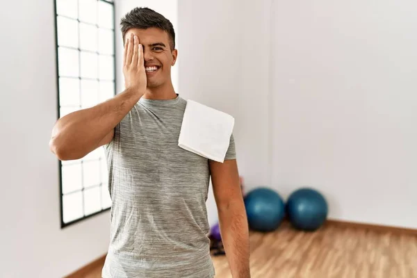 Young Hispanic Man Wearing Sportswear Towel Gym Covering One Eye — Fotografia de Stock
