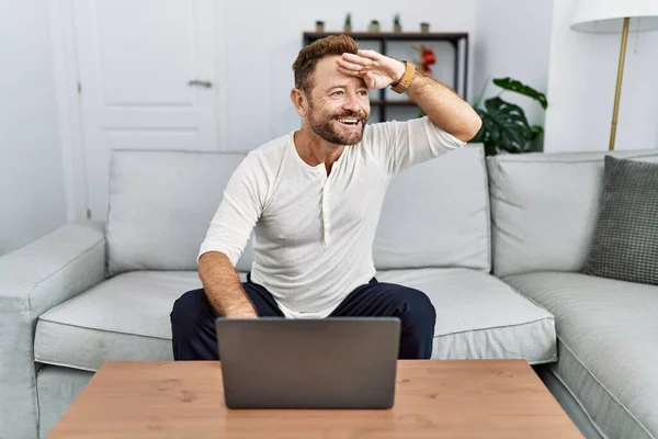 Middle Age Man Using Laptop Home Very Happy Smiling Looking — Stock Photo, Image