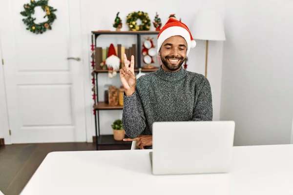 Young Hispanic Man Beard Wearing Christmas Hat Using Laptop Smiling — Stock Photo, Image