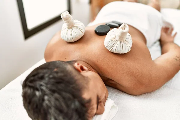 Young Hispanic Man Relaxed Having Back Massage Using Black Stones — Stock Photo, Image