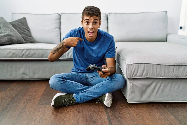 Young Handsome Hispanic Man Playing Video Game Sitting Sofa Pointing — Stock Photo, Image