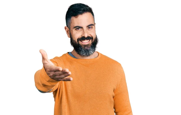 Hispanic Man Beard Wearing Casual Winter Sweater Smiling Friendly Offering — Stock fotografie