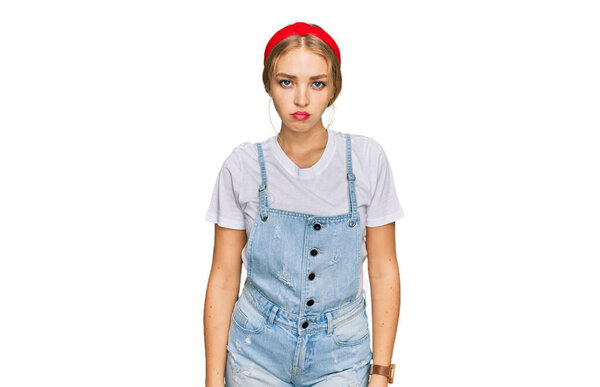 Young caucasian girl wearing casual clothes depressed and worry for distress, crying angry and afraid. sad expression. 