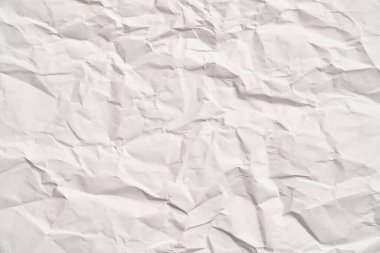 Kırışıklıkları olan beyaz buruşuk kağıt dokusu. Hasarlı ve yırtık çarşaf