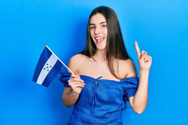 Young Brunette Teenager Holding Honduras Flag Smiling Idea Question Pointing — Stockfoto